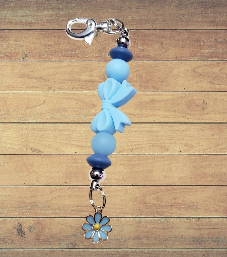 Venus Glam by Cadona Silicone Bag Tag Blue Beads and Bow with Floral Charm.